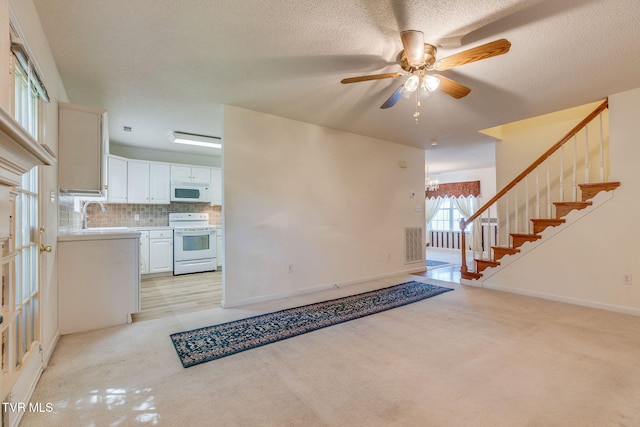811 Fain Ave Unit 811, Kingsport, TN 37660 - entrance foyer with light carpet, a ceiling fan, and stairway