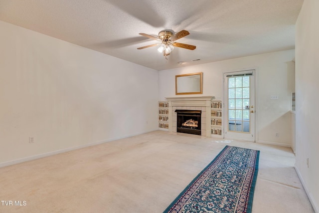 811 Fain Ave Unit 811, Kingsport, TN 37660 - unfurnished living room with carpet flooring, ceiling fan, a tiled fireplace, and a textured ceiling