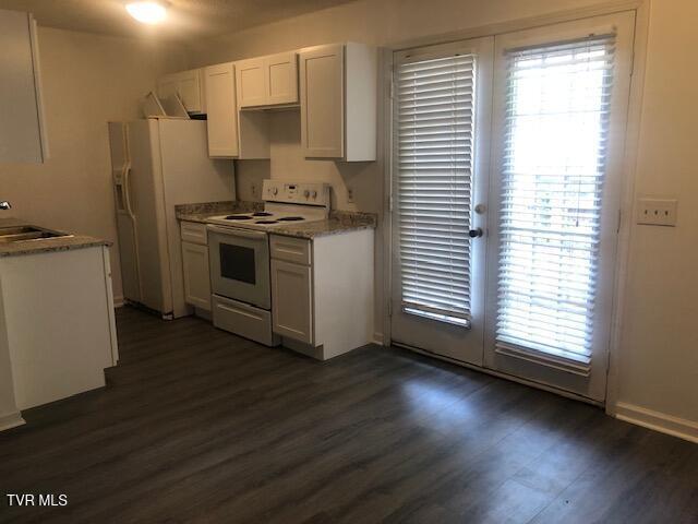 1005 Milton Ct Unit 1005, Kingsport, TN 37664 - kitchen featuring white appliances, dark wood-style flooring, white cabinetry, and french doors