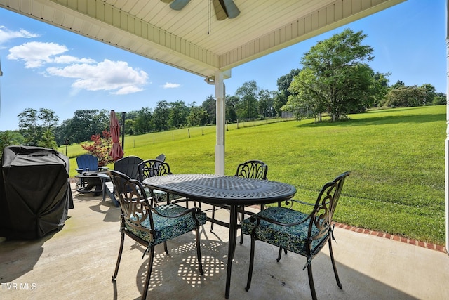 1251 Harmony Rd, Jonesborough, TN 37659 - view of patio with outdoor dining area, ceiling fan, a grill, and view of scattered trees