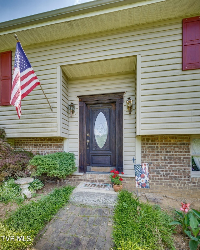 1049 Cooks Valley Rd, Kingsport, TN 37664 - view of exterior entry featuring brick siding