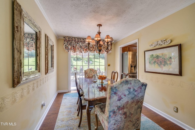 1049 Cooks Valley Rd, Kingsport, TN 37664 - dining space featuring a chandelier, ornamental molding, wood finished floors, and a textured ceiling
