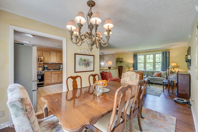 1049 Cooks Valley Rd, Kingsport, TN 37664 - dining area featuring a textured ceiling and a chandelier