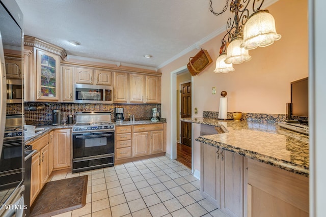 1049 Cooks Valley Rd, Kingsport, TN 37664 - kitchen with high end black range oven, stainless steel microwave, light brown cabinets, decorative backsplash, and ornamental molding