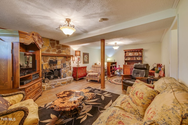 1049 Cooks Valley Rd, Kingsport, TN 37664 - living area with a textured ceiling, wood finished floors, and a stone fireplace