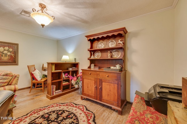 1049 Cooks Valley Rd, Kingsport, TN 37664 - living area featuring crown molding, light wood-style flooring, and a textured ceiling