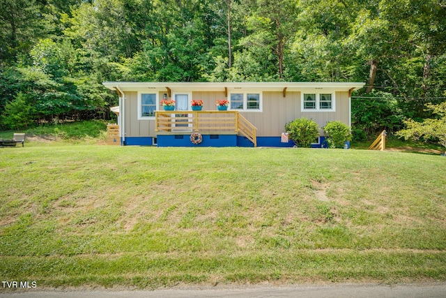 210 Anderson Rd, Johnson City, TN 37601 - view of front of home featuring board and batten siding, a front yard, and crawl space