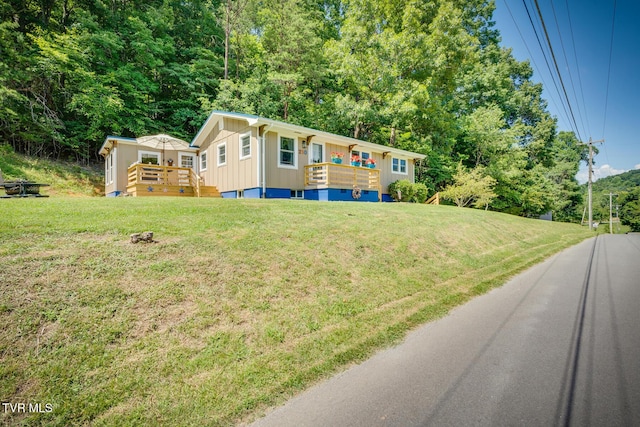 210 Anderson Rd, Johnson City, TN 37601 - view of front of property featuring board and batten siding, a wooden deck, and a front lawn