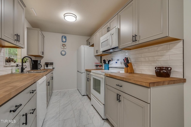 210 Anderson Rd, Johnson City, TN 37601 - kitchen featuring white appliances, wood counters, light marble finish floors, and decorative backsplash
