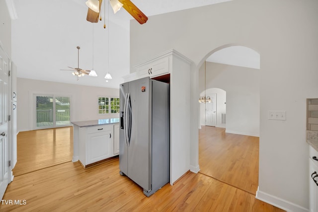 114 Wiltshire Dr, Gray, TN 37615 - kitchen featuring stainless steel fridge with ice dispenser, a ceiling fan, white cabinets, light wood-style floors, and high vaulted ceiling