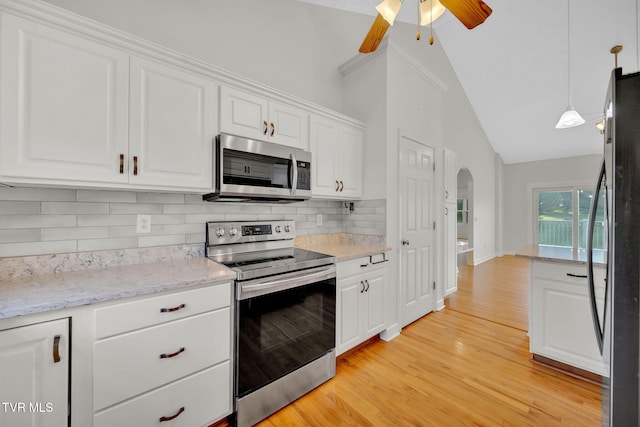 114 Wiltshire Dr, Gray, TN 37615 - kitchen featuring stainless steel appliances, arched walkways, lofted ceiling, white cabinetry, and ceiling fan