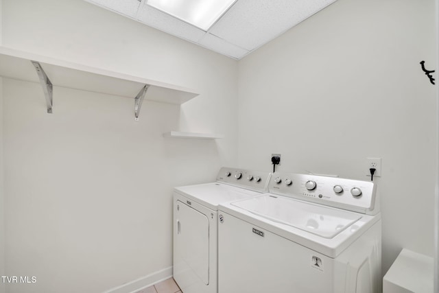 114 Wiltshire Dr, Gray, TN 37615 - washroom featuring washing machine and clothes dryer and light tile patterned flooring