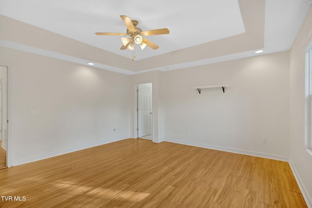 114 Wiltshire Dr, Gray, TN 37615 - empty room featuring ceiling fan, light wood-style floors, a tray ceiling, and recessed lighting