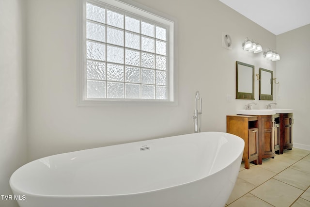 114 Wiltshire Dr, Gray, TN 37615 - full bathroom with vanity, a soaking tub, and tile patterned floors
