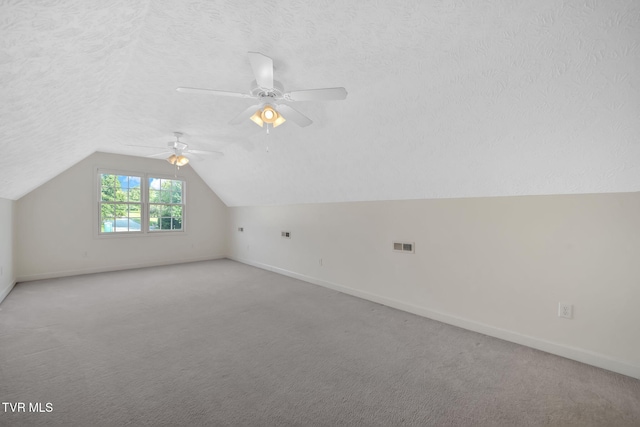 114 Wiltshire Dr, Gray, TN 37615 - additional living space featuring vaulted ceiling, light colored carpet, a ceiling fan, and a textured ceiling