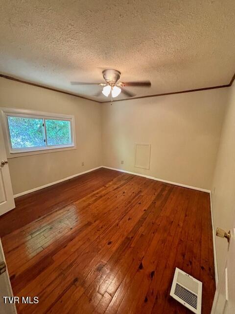 3219 Hardy Hollow Rd, Saint Paul, VA 24283 - empty room with wood-type flooring, ceiling fan, and a textured ceiling