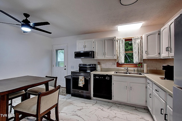 220 Tallman Dr, Blountville, TN 37617 - kitchen featuring black appliances, healthy amount of natural light, light countertops, light marble finish flooring, and a textured ceiling