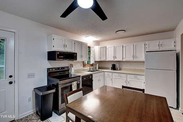 220 Tallman Dr, Blountville, TN 37617 - kitchen featuring freestanding refrigerator, stainless steel electric range, black dishwasher, ceiling fan, and tasteful backsplash