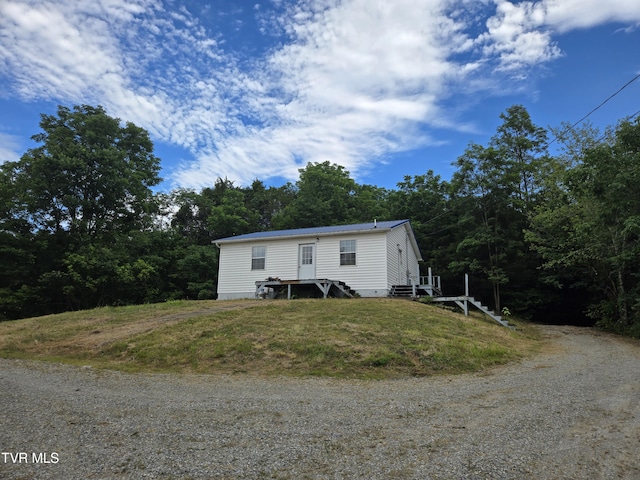 5875 Blue Springs Pkwy, Mosheim, TN 37818 - manufactured / mobile home featuring dirt driveway and entry steps