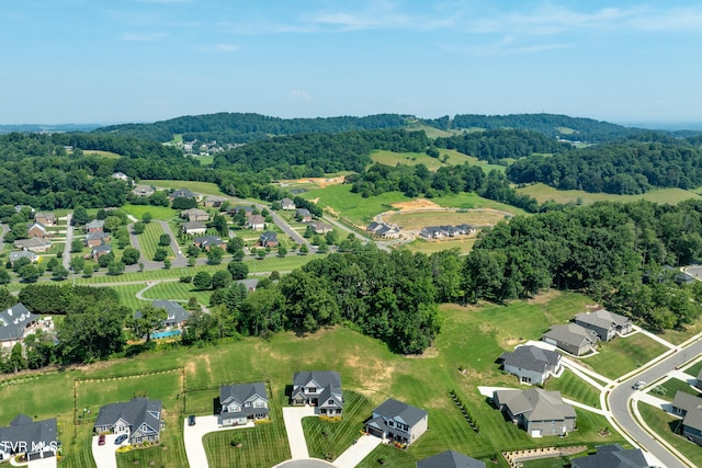 187 Tanners Cv, Johnson City, TN 37615 - aerial view of property and surrounding area featuring nearby suburban area and a forest