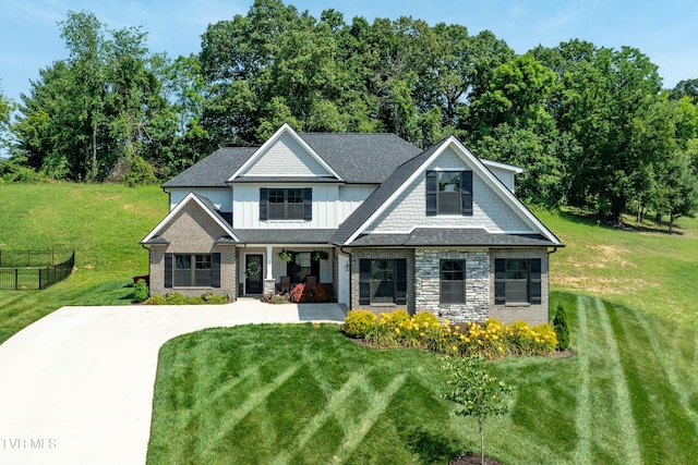 187 Tanners Cv, Johnson City, TN 37615 - craftsman house featuring a porch, board and batten siding, stone siding, and concrete driveway