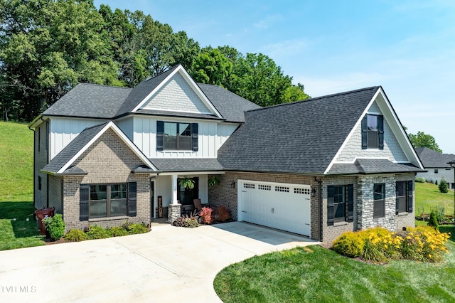 187 Tanners Cv, Johnson City, TN 37615 - view of front of property featuring board and batten siding, covered porch, brick siding, and an attached garage