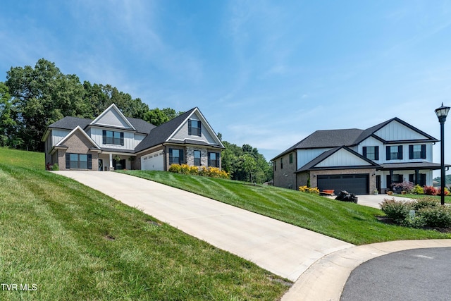 187 Tanners Cv, Johnson City, TN 37615 - craftsman-style house with stone siding, concrete driveway, a front yard, and a garage