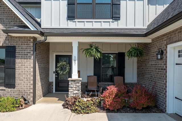 187 Tanners Cv, Johnson City, TN 37615 - entrance to property with board and batten siding, covered porch, and brick siding