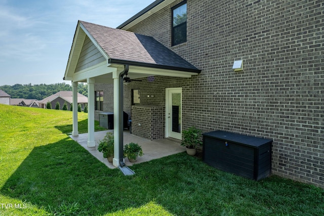187 Tanners Cv, Johnson City, TN 37615 - rear view of house with a patio, a lawn, brick siding, and a ceiling fan