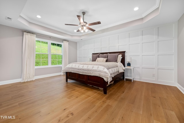 187 Tanners Cv, Johnson City, TN 37615 - bedroom with a raised ceiling, crown molding, light wood finished floors, recessed lighting, and a ceiling fan