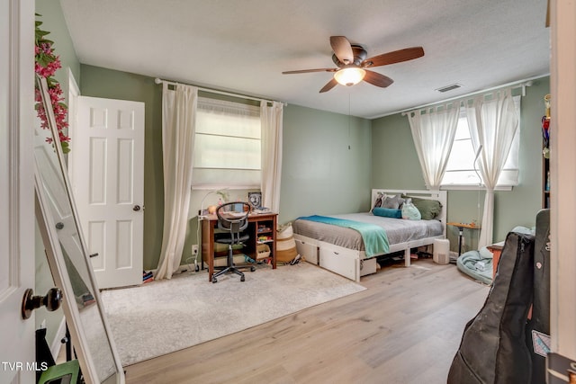 1136 W Shipley Ferry Rd, Kingsport, TN 37663 - bedroom with wood finished floors, ceiling fan, and a textured ceiling