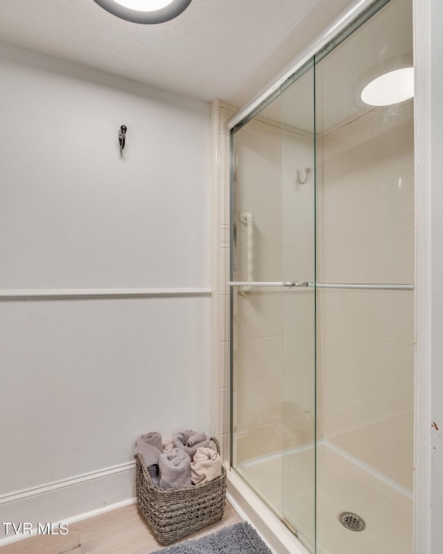 1136 W Shipley Ferry Rd, Kingsport, TN 37663 - bathroom featuring a stall shower and a textured ceiling