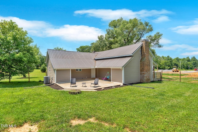 104 Kincheloe Rd, Fall Branch, TN 37656 - back of property featuring a patio, a chimney, a yard, and a metal roof