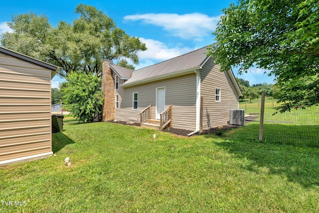 104 Kincheloe Rd, Fall Branch, TN 37656 - rear view of house featuring a chimney and a metal roof