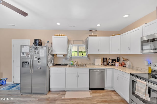 104 Kincheloe Rd, Fall Branch, TN 37656 - kitchen featuring appliances with stainless steel finishes, white cabinetry, recessed lighting, and light stone counters