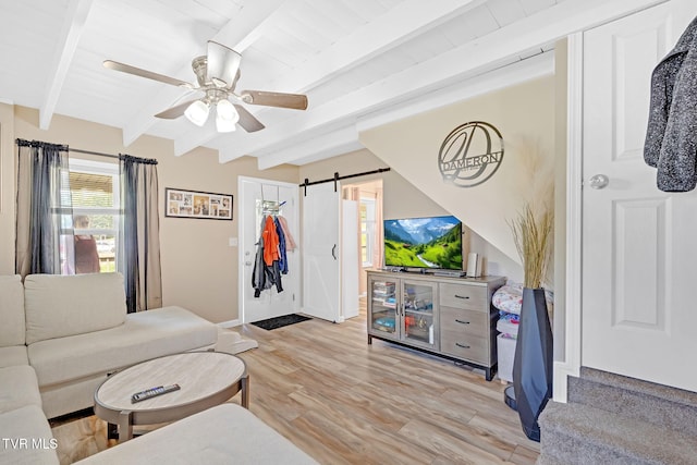 104 Kincheloe Rd, Fall Branch, TN 37656 - living room featuring a barn door, light wood finished floors, beam ceiling, and a ceiling fan