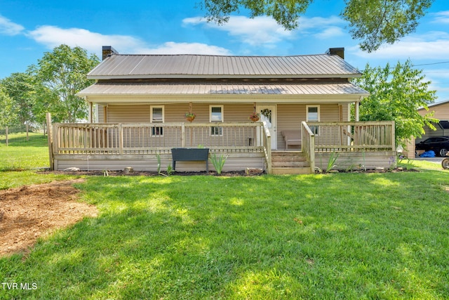 104 Kincheloe Rd, Fall Branch, TN 37656 - rear view of house featuring a lawn, a porch, a metal roof, and a chimney