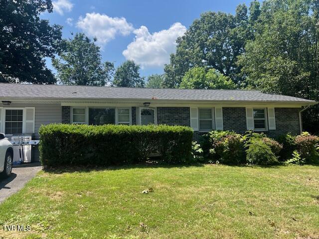 4001 W Englewood Blvd, Johnson City, TN 37601 - single story home with a front lawn and brick siding
