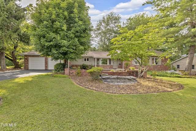 700 Sharon Dr, Johnson City, TN 37604 - view of front of home featuring asphalt driveway, brick siding, a front yard, and a shingled roof