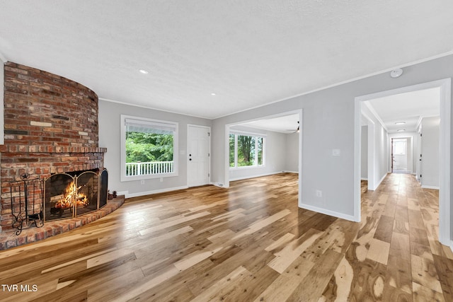 700 Sharon Dr, Johnson City, TN 37604 - unfurnished living room featuring ornamental molding, a fireplace, hardwood / wood-style flooring, and recessed lighting