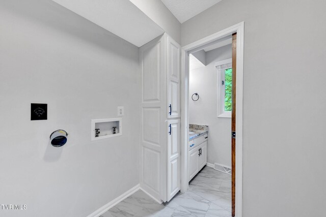 700 Sharon Dr, Johnson City, TN 37604 - laundry room featuring hookup for a washing machine, light marble finish flooring, and hookup for an electric dryer