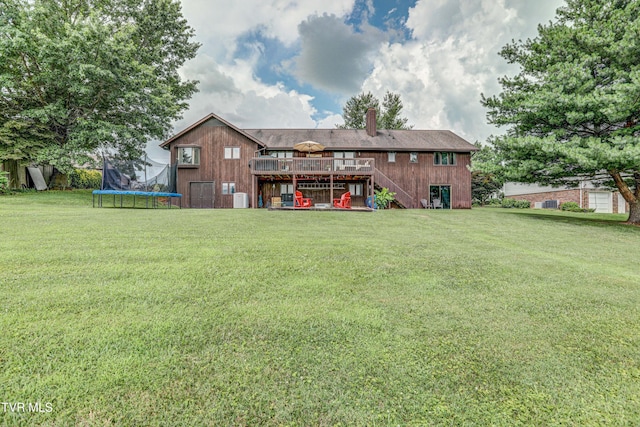 400 Heatherview Ct, Kingsport, TN 37663 - back of house with stairs, a trampoline, a deck, a chimney, and a lawn