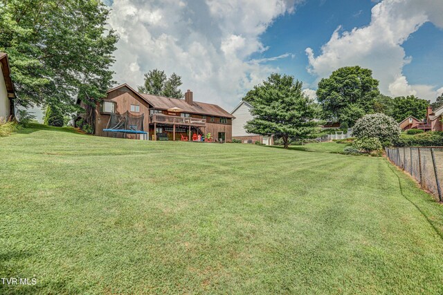 400 Heatherview Ct, Kingsport, TN 37663 - view of yard with a trampoline and a wooden deck