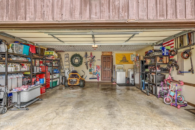 400 Heatherview Ct, Kingsport, TN 37663 - garage featuring separate washer and dryer and a garage door opener