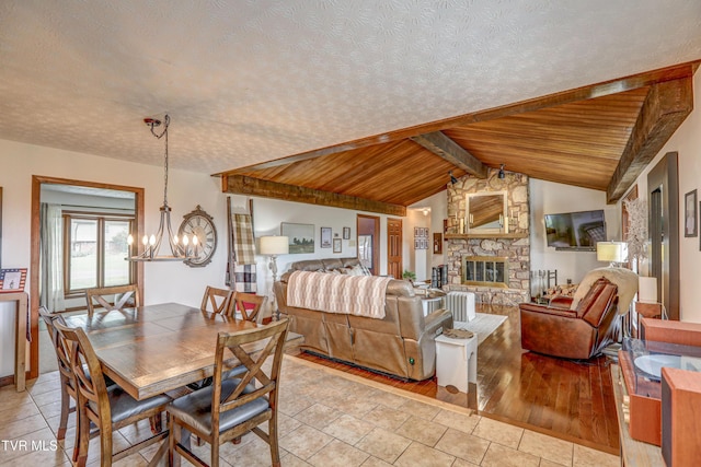 400 Heatherview Ct, Kingsport, TN 37663 - dining area featuring a chandelier, a fireplace, wooden ceiling, and light tile patterned floors