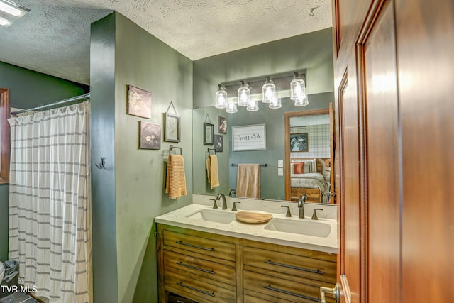 400 Heatherview Ct, Kingsport, TN 37663 - bathroom featuring double vanity, ensuite bath, and a textured ceiling