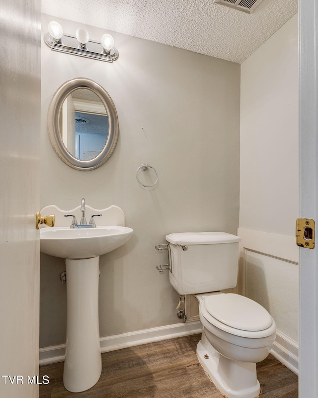 815 7th St Unit 815, Bristol, TN 37620 - half bath with wood finished floors and a textured ceiling