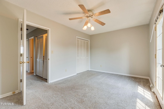 815 7th St Unit 815, Bristol, TN 37620 - unfurnished bedroom featuring carpet floors, a closet, ceiling fan, and a textured ceiling