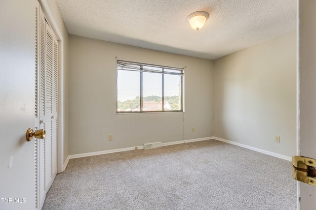 815 7th St Unit 815, Bristol, TN 37620 - unfurnished bedroom with carpet floors, a closet, and a textured ceiling