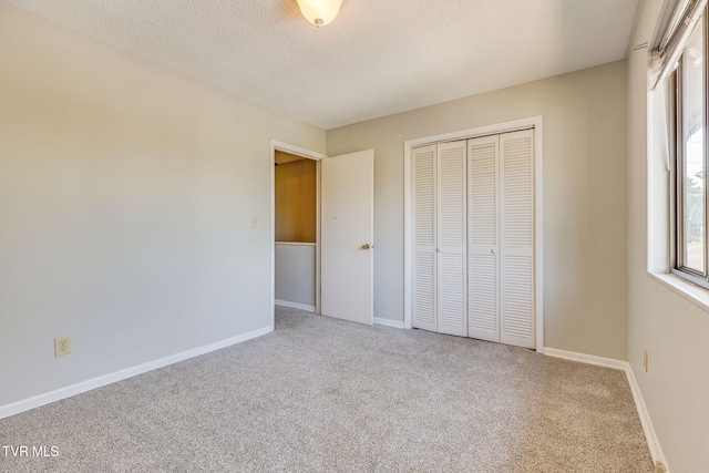 815 7th St Unit 815, Bristol, TN 37620 - unfurnished bedroom featuring carpet floors, a closet, and a textured ceiling